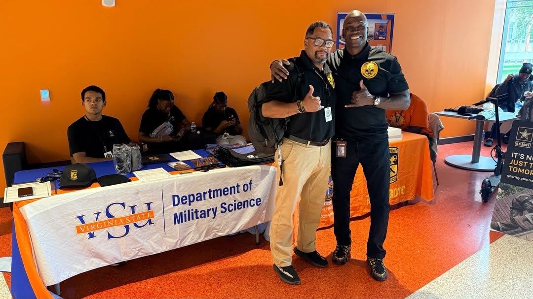 Brothers at the VSU Department of Military Science table